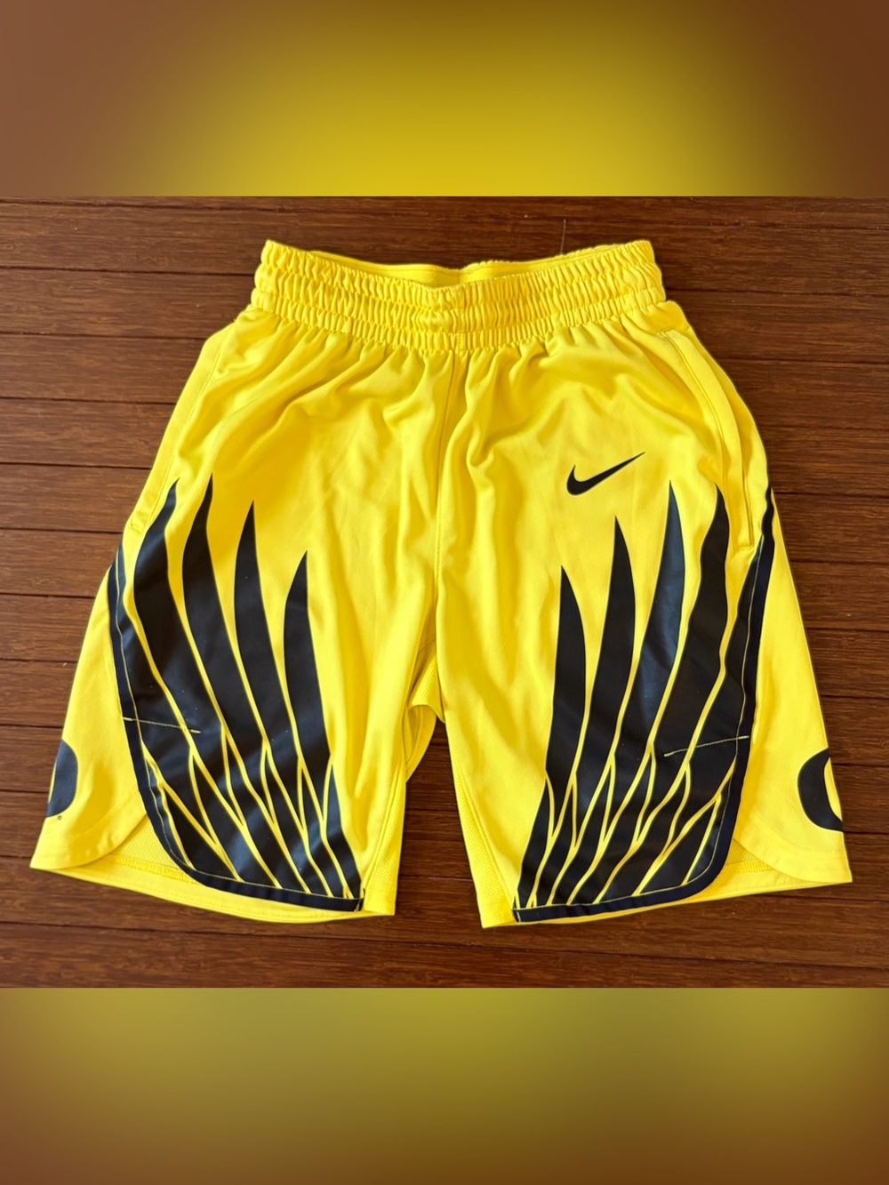Nike Men’s Yellow Athletic Shorts with Black Wing Graphics